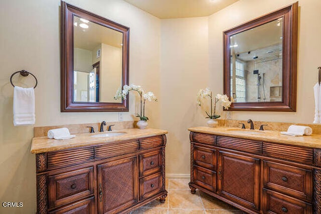 full bathroom featuring two vanities, a sink, and tile patterned floors