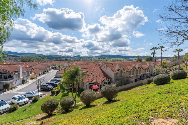 birds eye view of property with a residential view and a mountain view