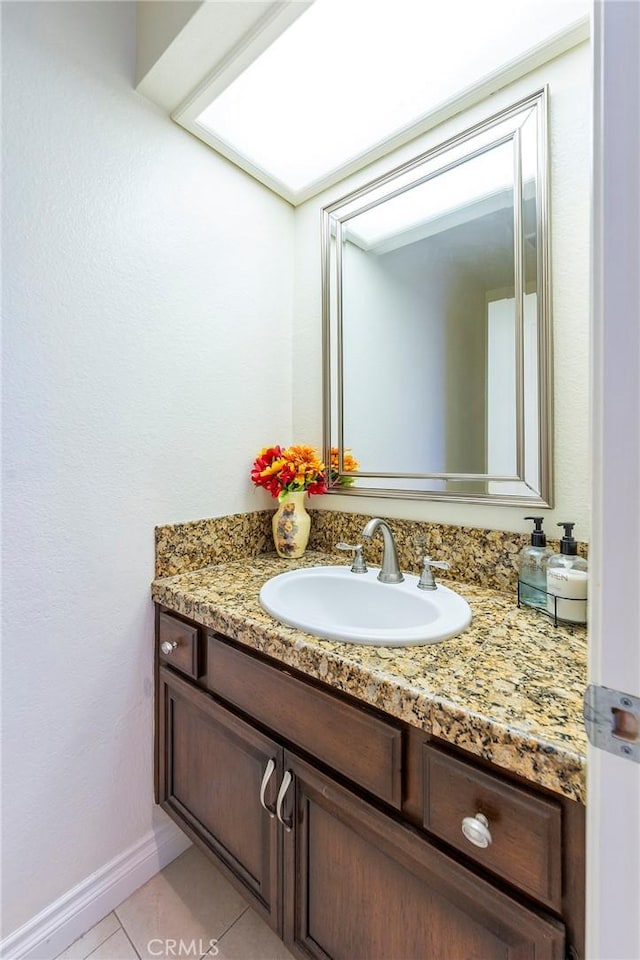 bathroom with vanity and tile patterned floors