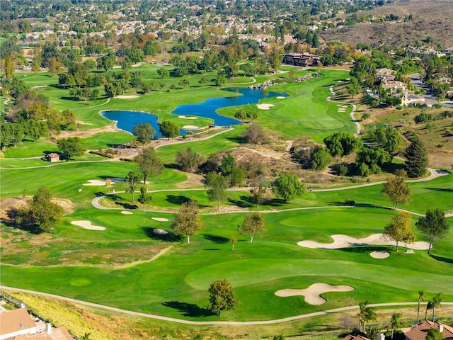 bird's eye view with a water view and golf course view