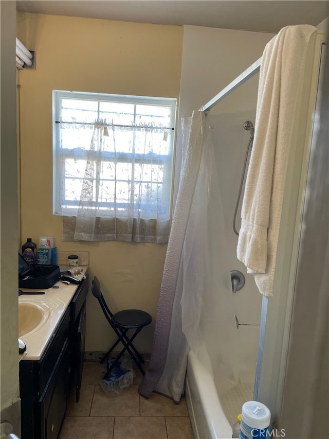 bathroom featuring vanity, tile patterned floors, and a shower with shower curtain