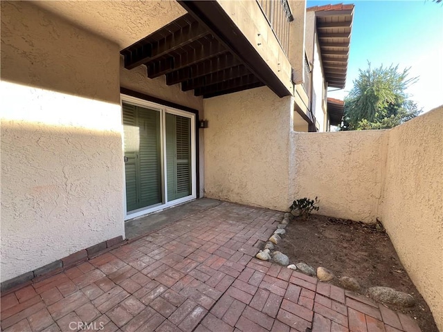 view of patio / terrace featuring fence