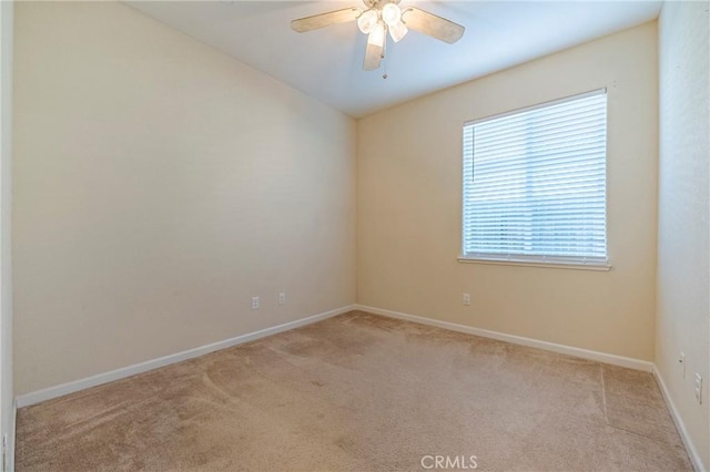 carpeted empty room with ceiling fan