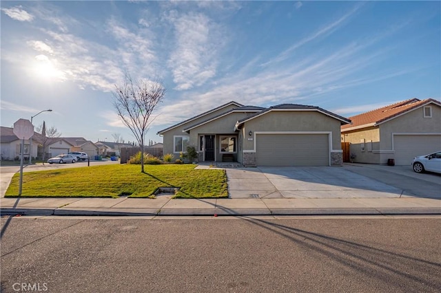 view of front of home featuring a garage and a front lawn