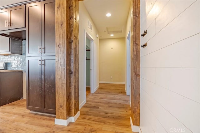 corridor featuring light hardwood / wood-style floors