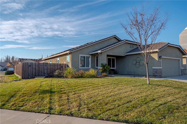 single story home with a garage and a front lawn