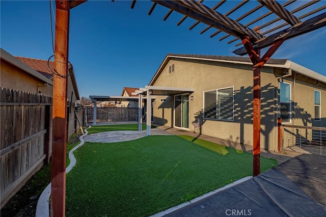 view of yard with a pergola and a patio