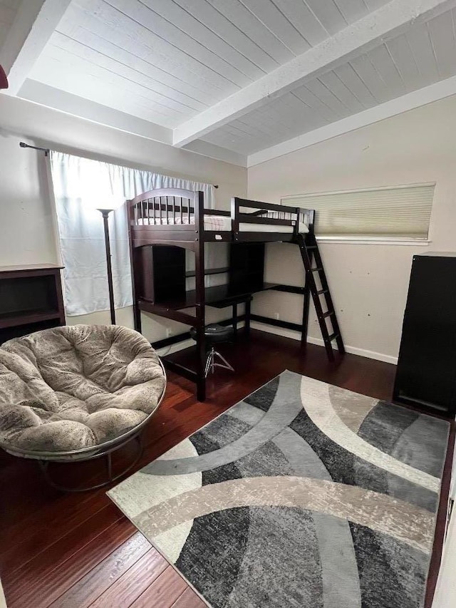 bedroom featuring wood ceiling, dark hardwood / wood-style floors, and beamed ceiling