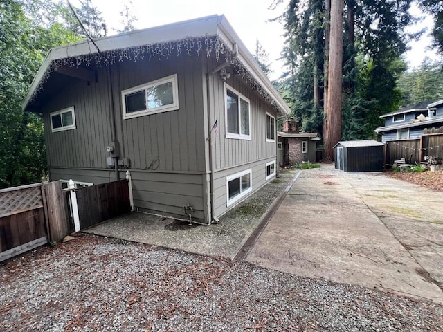 view of side of home featuring a patio area