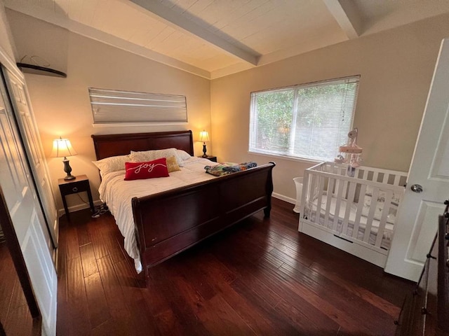 bedroom featuring dark hardwood / wood-style flooring and lofted ceiling with beams