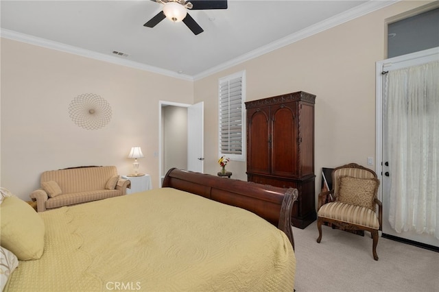 bedroom with ceiling fan, ornamental molding, and light carpet