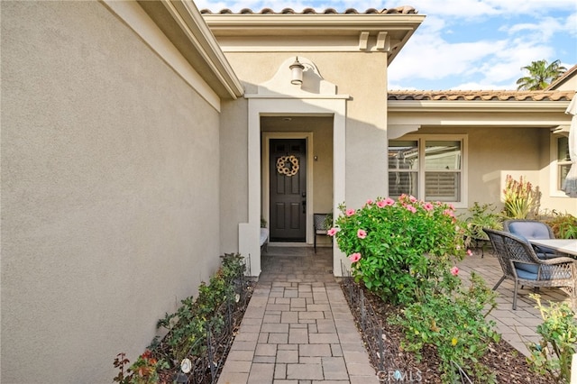 entrance to property with a patio area