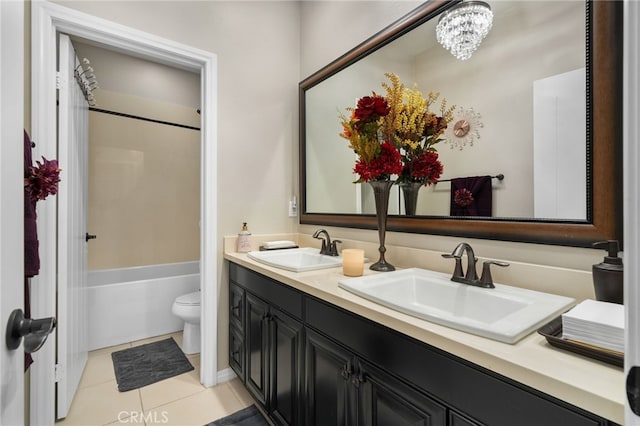 full bathroom with tile patterned flooring, vanity, bathing tub / shower combination, and toilet