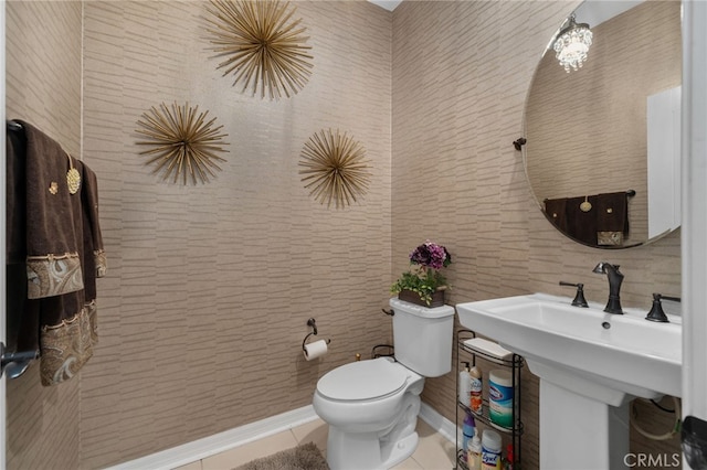 bathroom featuring tile patterned flooring, sink, and toilet