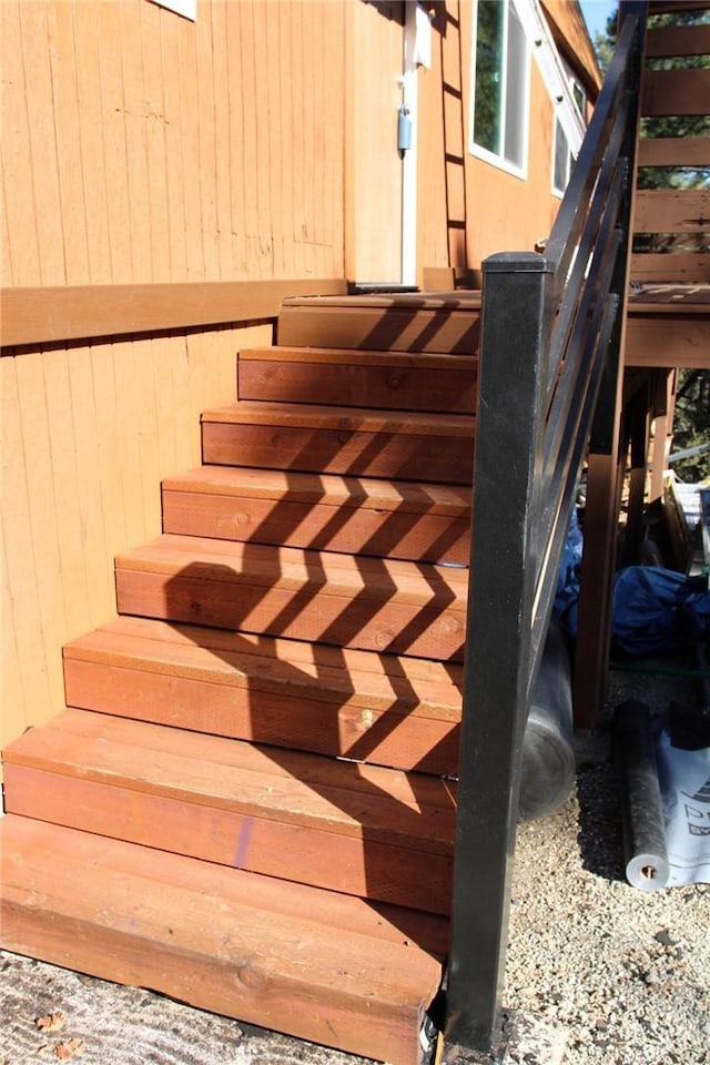 staircase with wooden walls