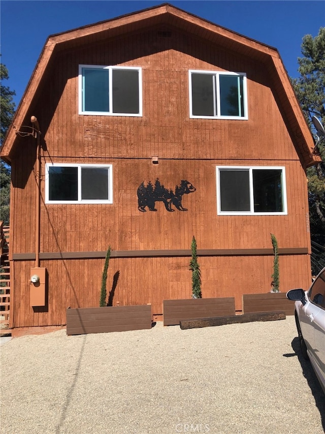 view of property exterior featuring a patio area