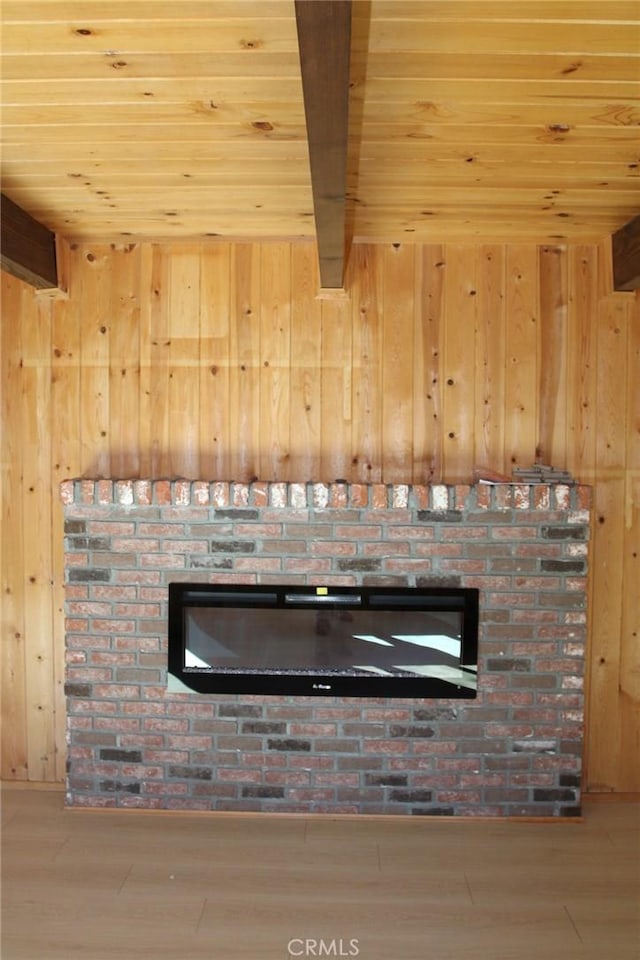 details with beamed ceiling, hardwood / wood-style flooring, wooden ceiling, and wooden walls