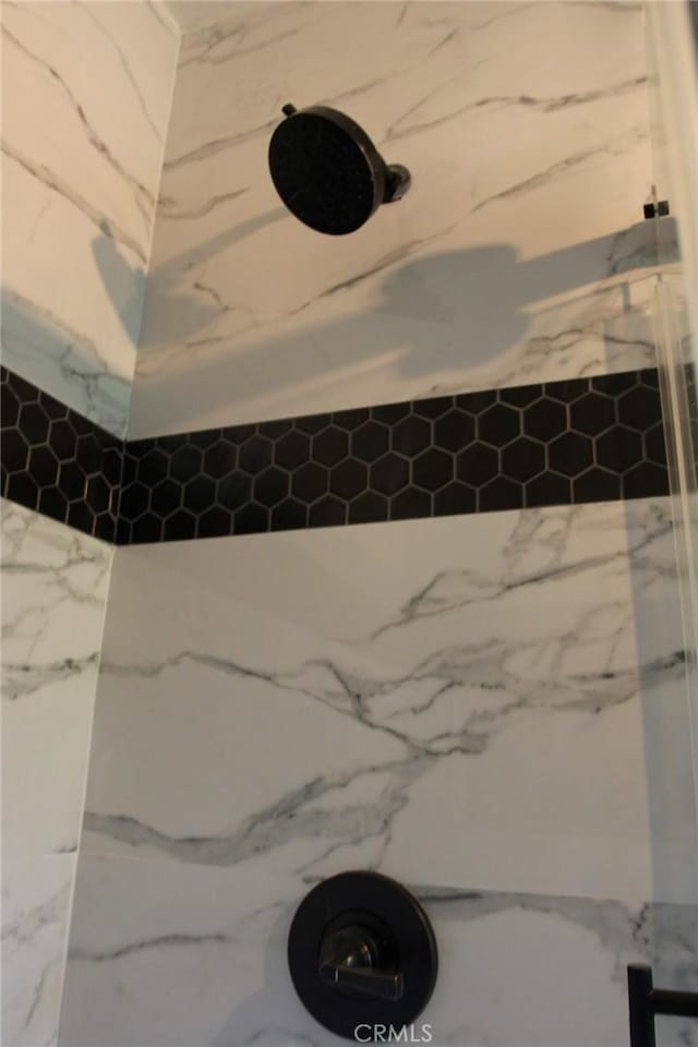 room details with a tile shower