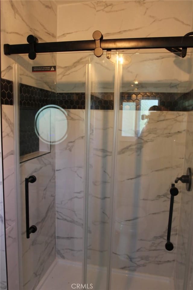 bathroom with an enclosed shower