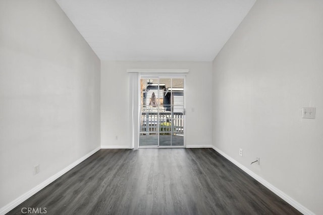 empty room featuring dark wood-type flooring