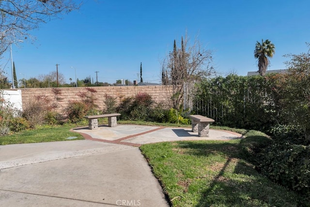 surrounding community featuring a patio