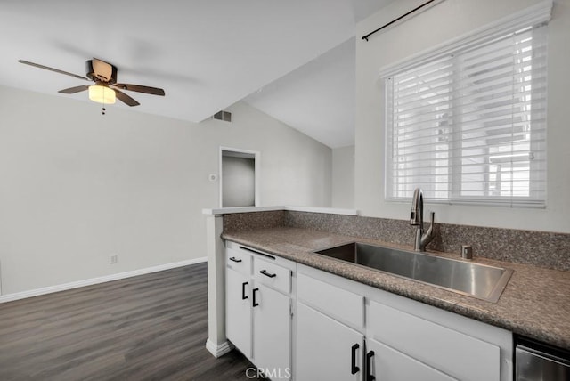 kitchen featuring lofted ceiling, sink, white cabinetry, dark hardwood / wood-style floors, and ceiling fan