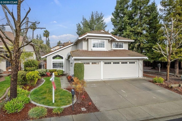 front of property featuring a garage and a front yard