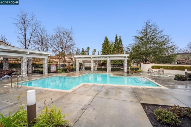 view of swimming pool featuring a patio area