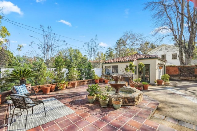 view of patio with an outbuilding