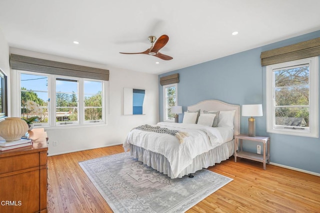 bedroom featuring ceiling fan and light hardwood / wood-style flooring