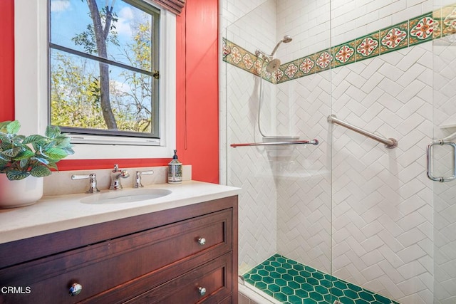 bathroom with walk in shower and vanity