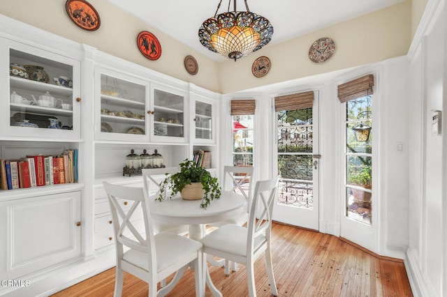 dining area with light hardwood / wood-style floors