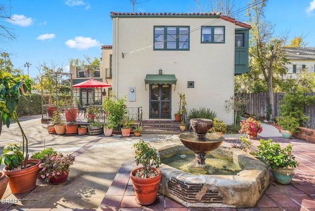 rear view of property featuring a patio