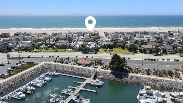 birds eye view of property featuring a view of the beach and a water view