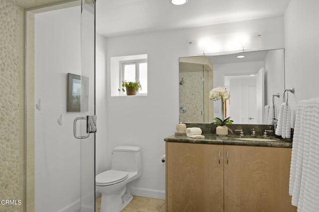 bathroom with vanity, an enclosed shower, tile patterned floors, and toilet