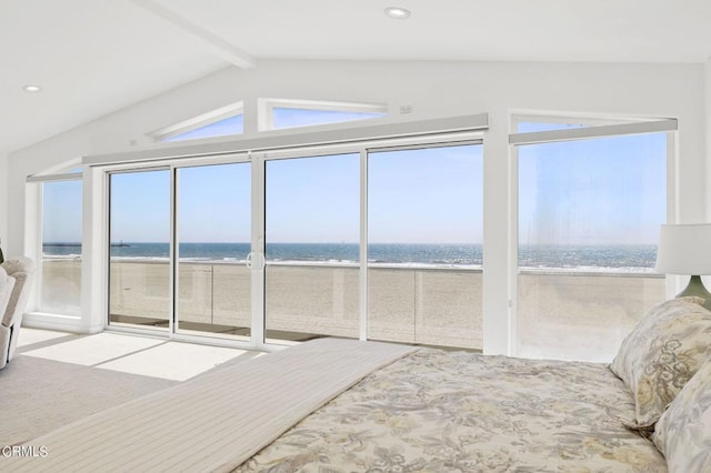 bedroom with a water view, a beach view, and vaulted ceiling with beams