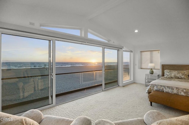 carpeted bedroom with a view of the beach, vaulted ceiling with beams, access to outside, and a water view