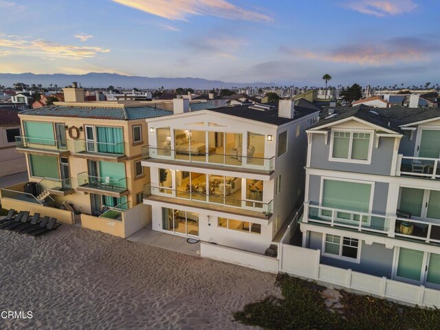 3757 Ocean Dr, Oxnard, CA 93035 - back of property featuring a chimney and a mountain view