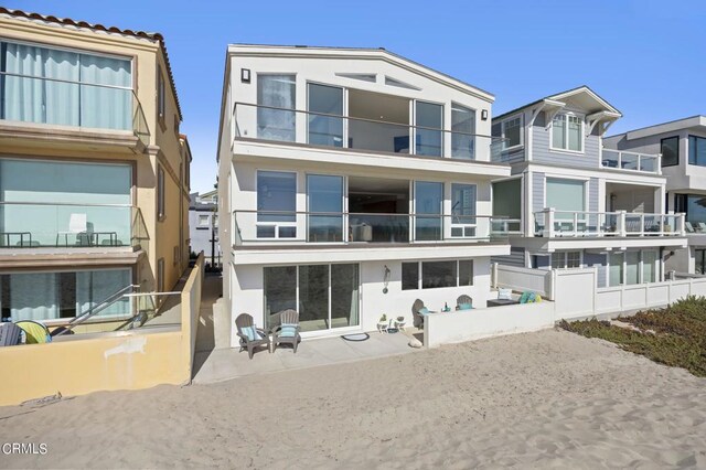 3757 Ocean Dr, Oxnard, CA 93035 - rear view of house featuring a patio area and stucco siding