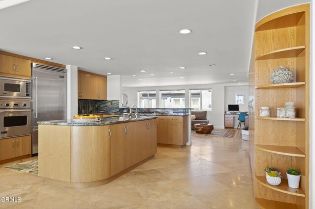 3757 Ocean Dr, Oxnard, CA 93035 - kitchen featuring built in appliances, recessed lighting, a kitchen island with sink, open shelves, and backsplash
