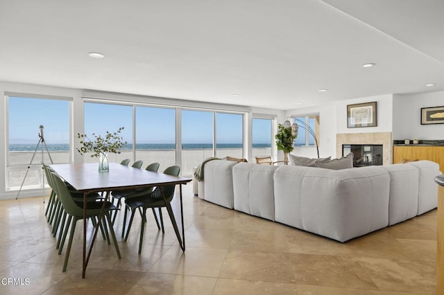 3757 Ocean Dr, Oxnard, CA 93035 - living room featuring a fireplace, recessed lighting, a water view, and light tile patterned floors