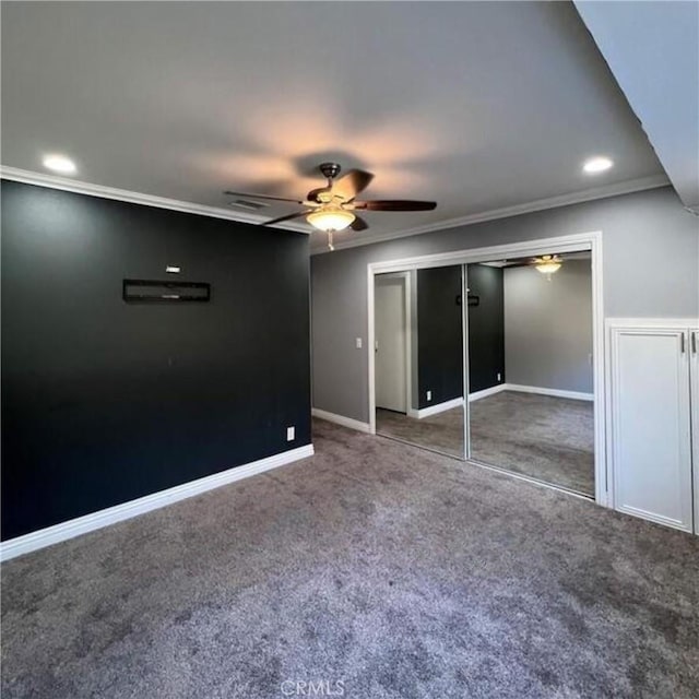 unfurnished bedroom featuring ceiling fan, ornamental molding, carpet floors, and a closet