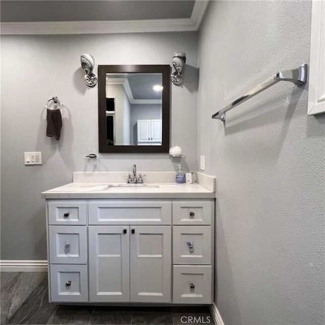 bathroom featuring vanity and ornamental molding