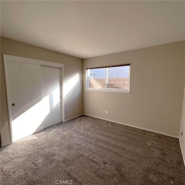 empty room featuring carpet floors