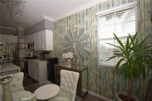 dining area featuring crown molding