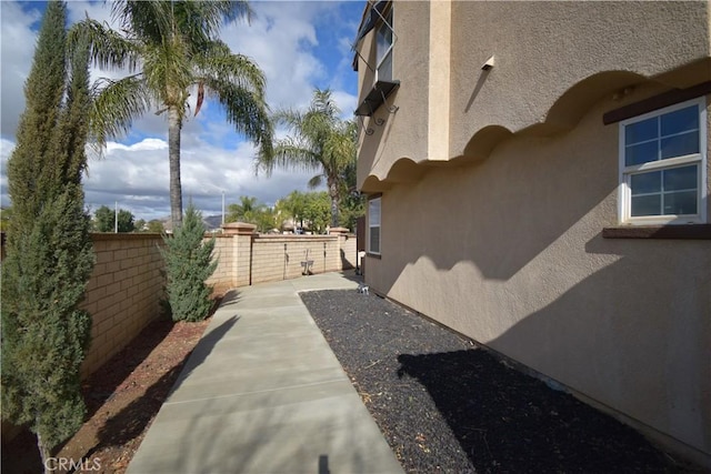 view of property exterior featuring a patio