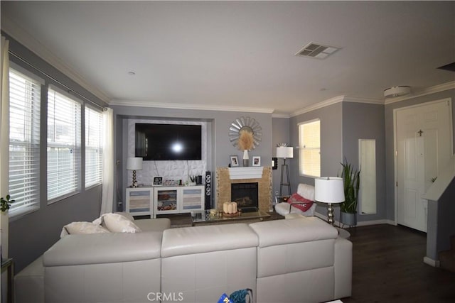 living room featuring ornamental molding and dark hardwood / wood-style floors