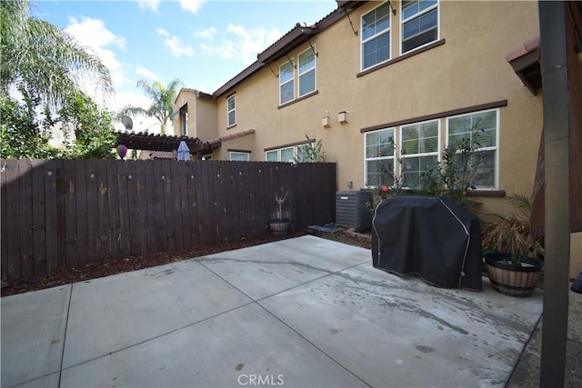 view of patio / terrace featuring central air condition unit, grilling area, and a pergola