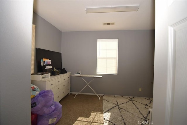 bedroom featuring light carpet