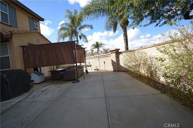 view of side of home with an outdoor hangout area and a patio